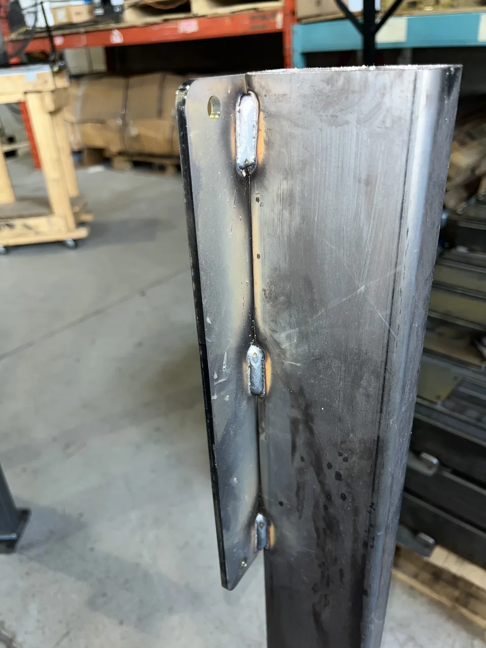 Welded mounting bracket on an RWS production floor stand