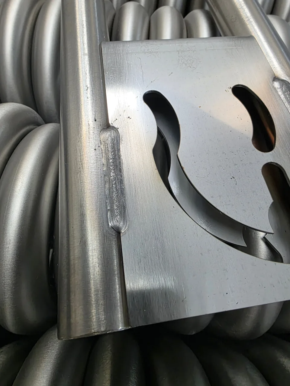 Stainless-steel welded tubes and fixture plate from an RWS production program